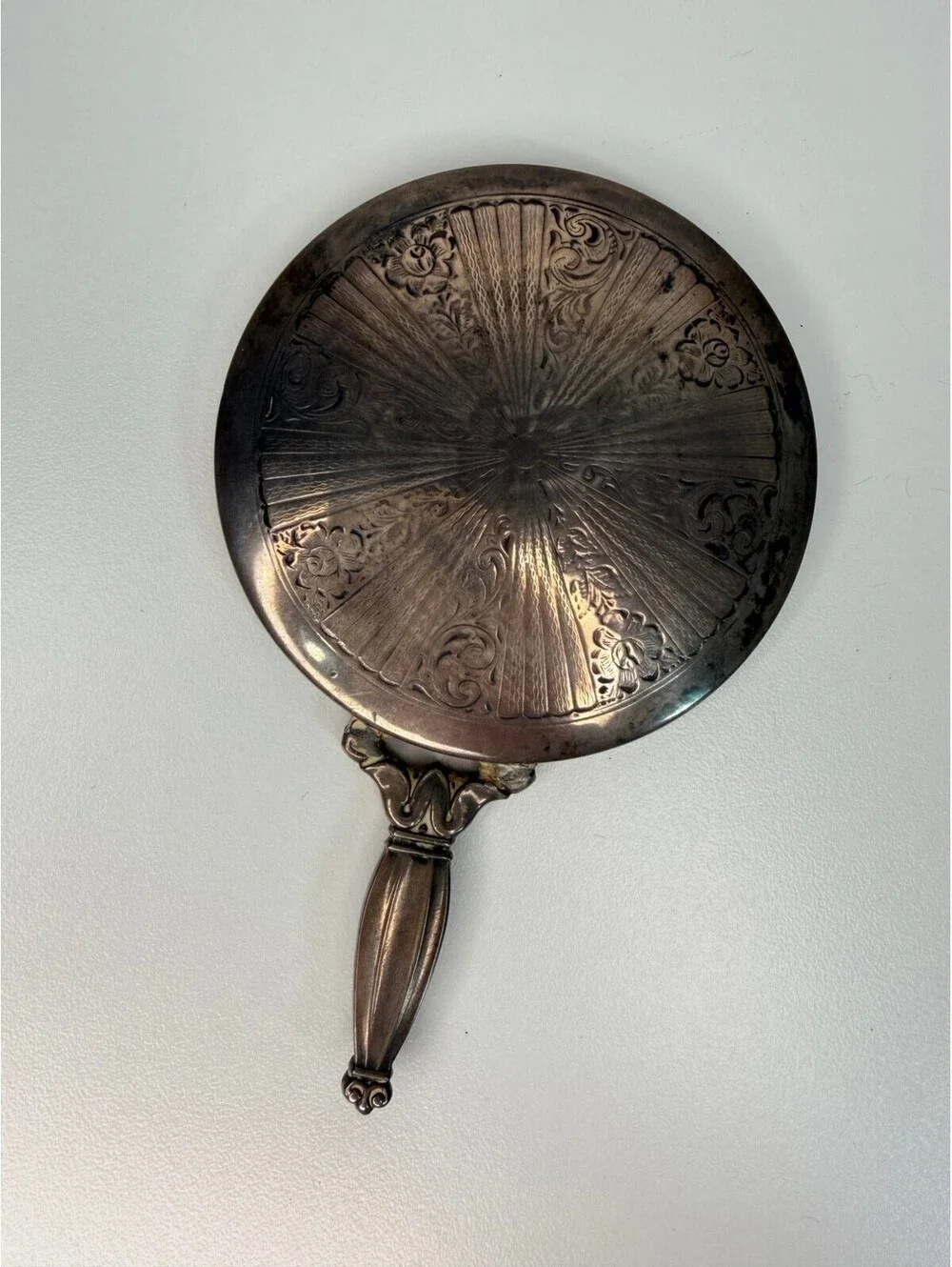 Vintage antique silver tone hand mirror with engraved sunburst back